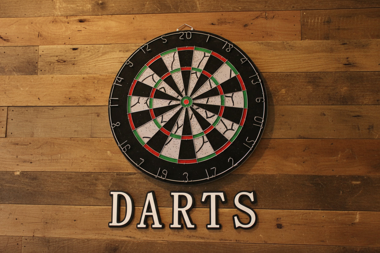 Dartboard with 'Darts' text on a wooden background